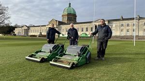 Andy Richards, grounds manager at Haileybury School (centre), with the Dennis ES-34R battery-powered rotary mower - Credit: Dennis